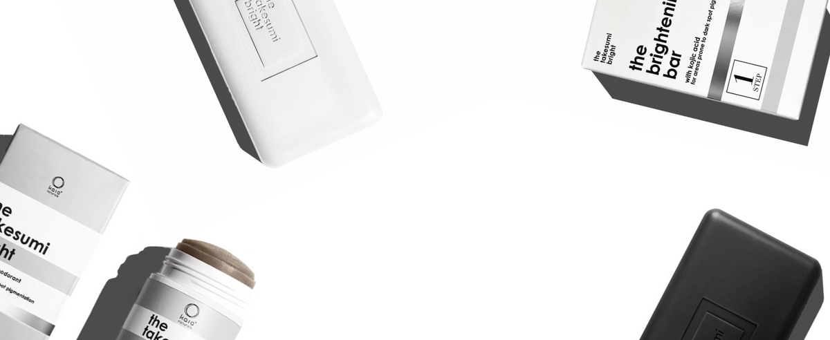 Cosmetic products including a jar, bar, and boxes on a white background